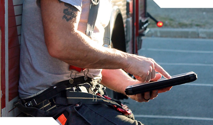 Fireman on break points at his mobile device
