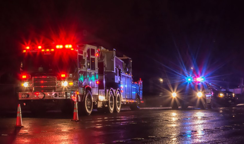 FirstNet first responders on wet road at night