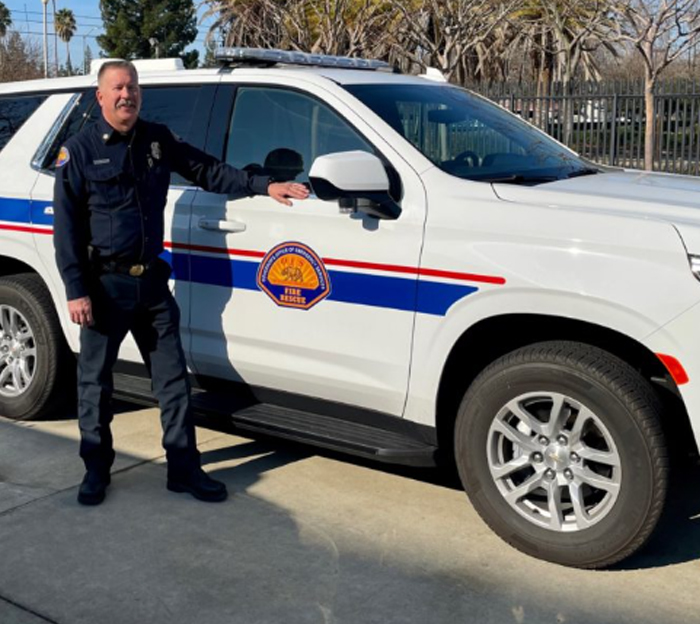 Fire rescue officer next to vehicle