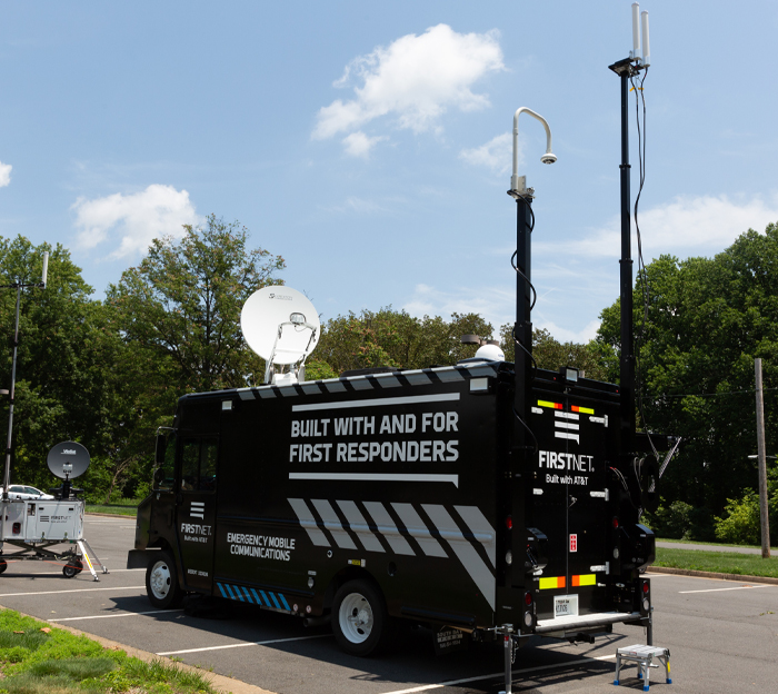 FirstNet truck deployed in parking lot with satellites and Compact Rapid Deployable (CRD)