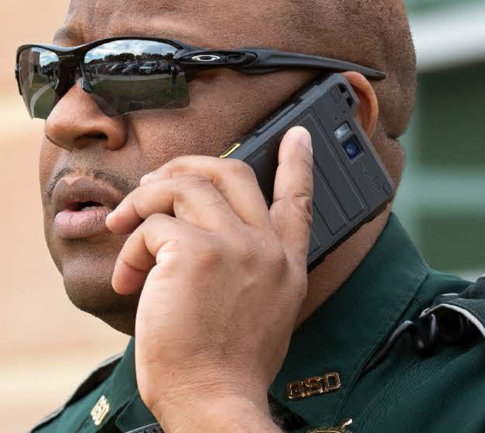 Sheriff talking on mobile device
