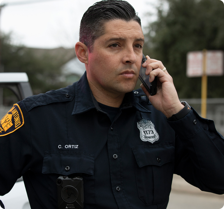 Police officer using a smart phone