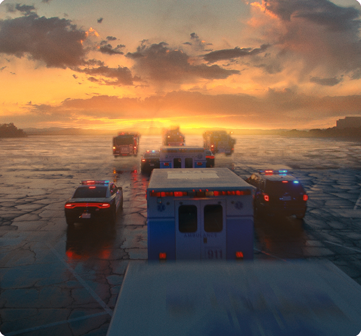 Emergency vehicles riding into the sunset