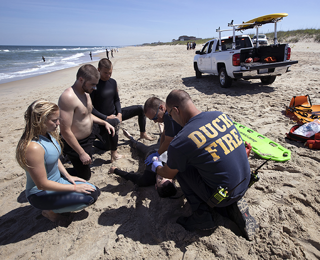 Surf Rescue lifeguards and EMTs train by doing a simulation of a swimmer in trouble <a href=