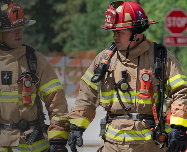 Two firefighters having a conversation