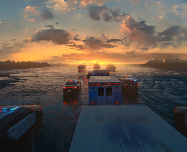 First responder vehicles driving into the horizon