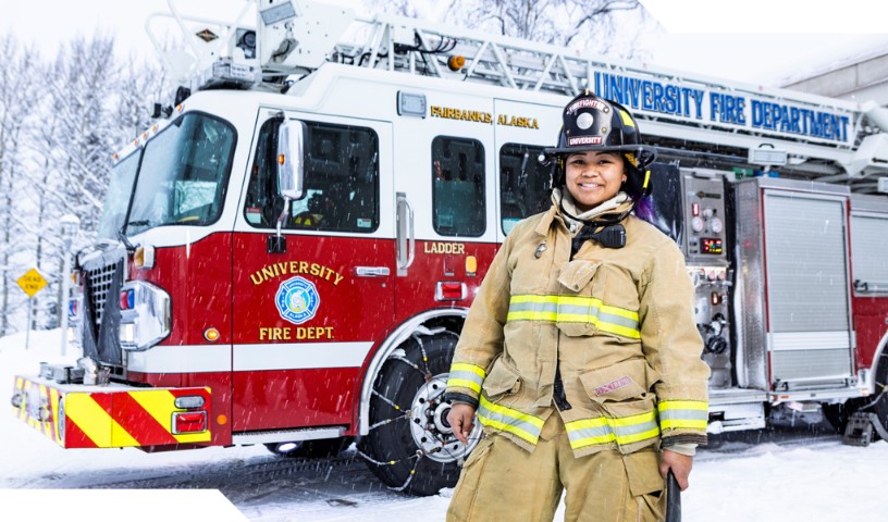 Firefighter in the snow, in front of firetruck - Fairbanks, Alaska