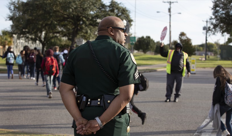 Policeman observes school crosswalk